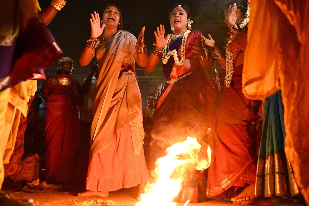 The transgender community dance freely during the annual Koovagam transgender festival at the Koothandavar temple in Tamil Nadu's Kallakurichi district. — AFP pic