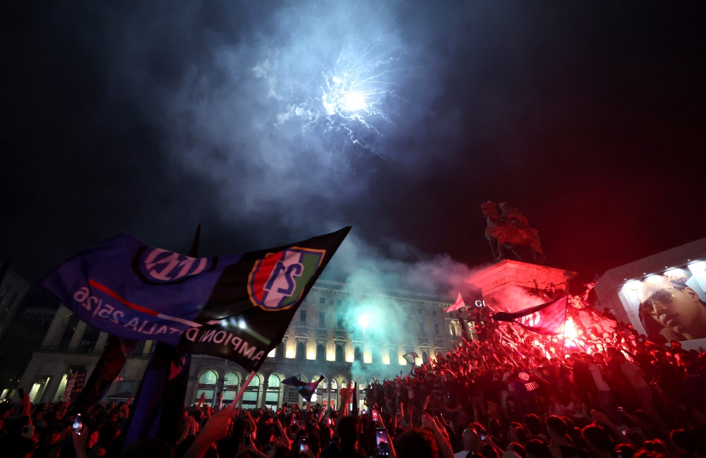 Inter Milan fans celebrate with fireworks after winning Serie A at Duomo Square in Milan, Italy, May 3, 2026. — Reuters pic