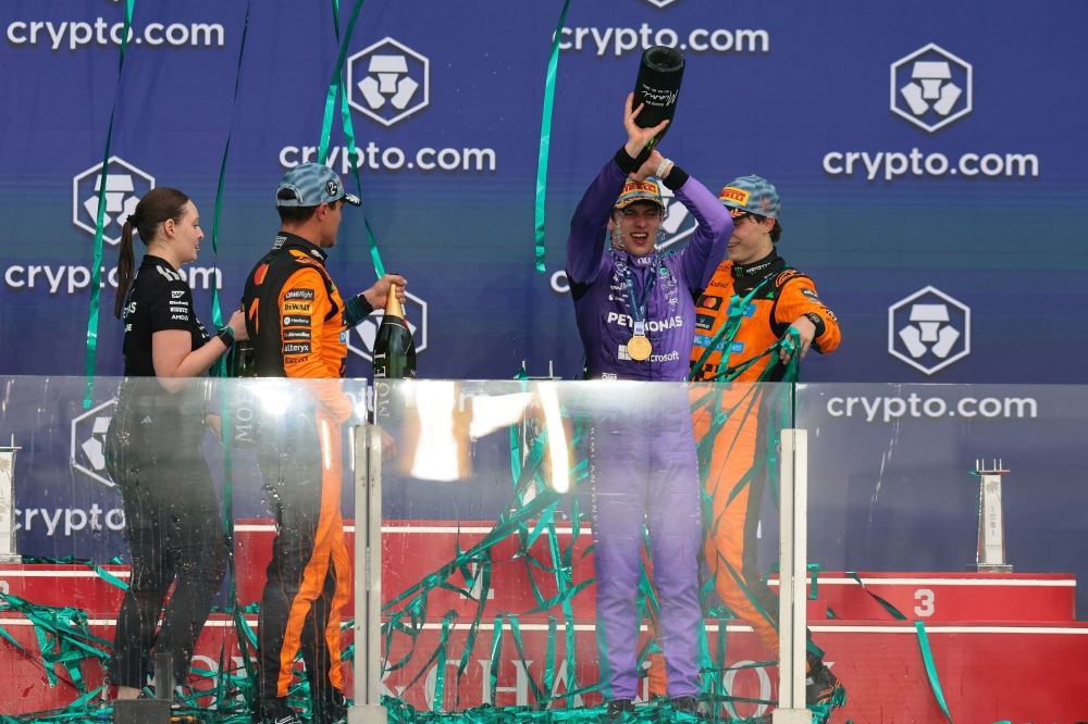 Mercedes driver Andrea Kimi Antonelli reacts on the podium with McLaren drivers Lando Norris and Oscar Piastri after winning the Miami Grand Prix at Miami International Autodrome in Miami Gardens, Florida, May 4, 2026. — Reuters pic