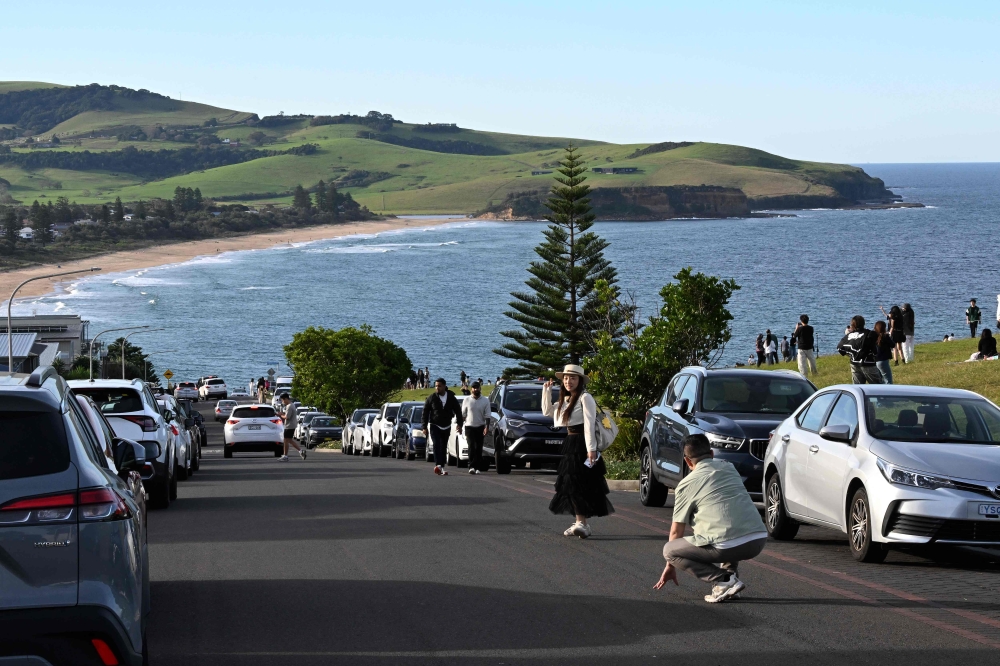Viral posts of an Australian street dubbed the country’s ‘most beautiful’ have enticed coachloads of visitors to a picturesque seaside town. — AFP pic