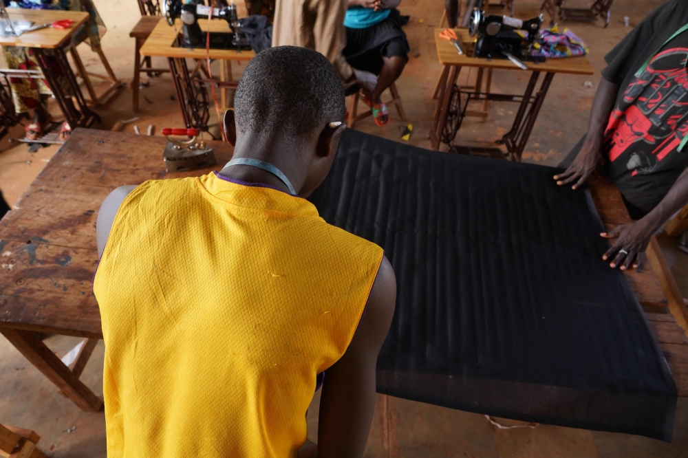 In a classroom in Bria in the unstable eastern Central African Republic, former child soldiers were learning to sew. — AFP pic