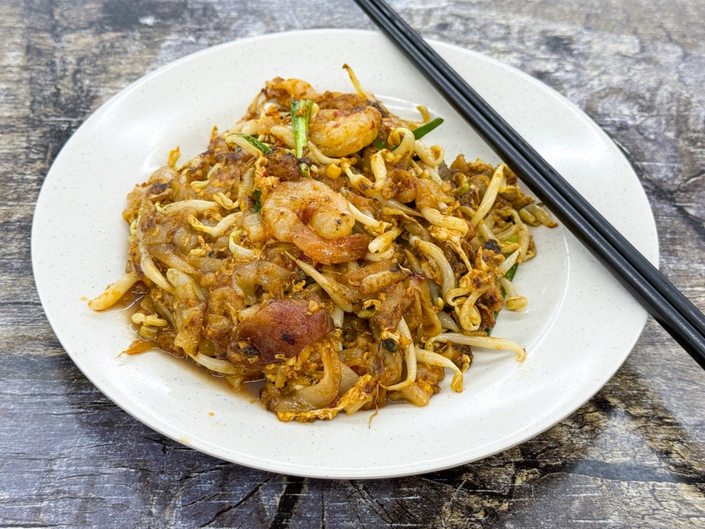 'Char kway teow' is a popular order here and it’s moist with softer strands. — Picture by Lee Khang Yi