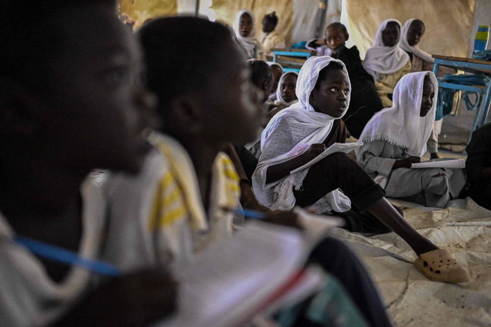 Displaced Sudanese students attend a class at an elementary school run by the Sudanese Coalition for Education in partnership with the United Nations International Children’s Emergency Fund (Unicef), south of Port Sudan, on April 26, 2026. — AFP pic 