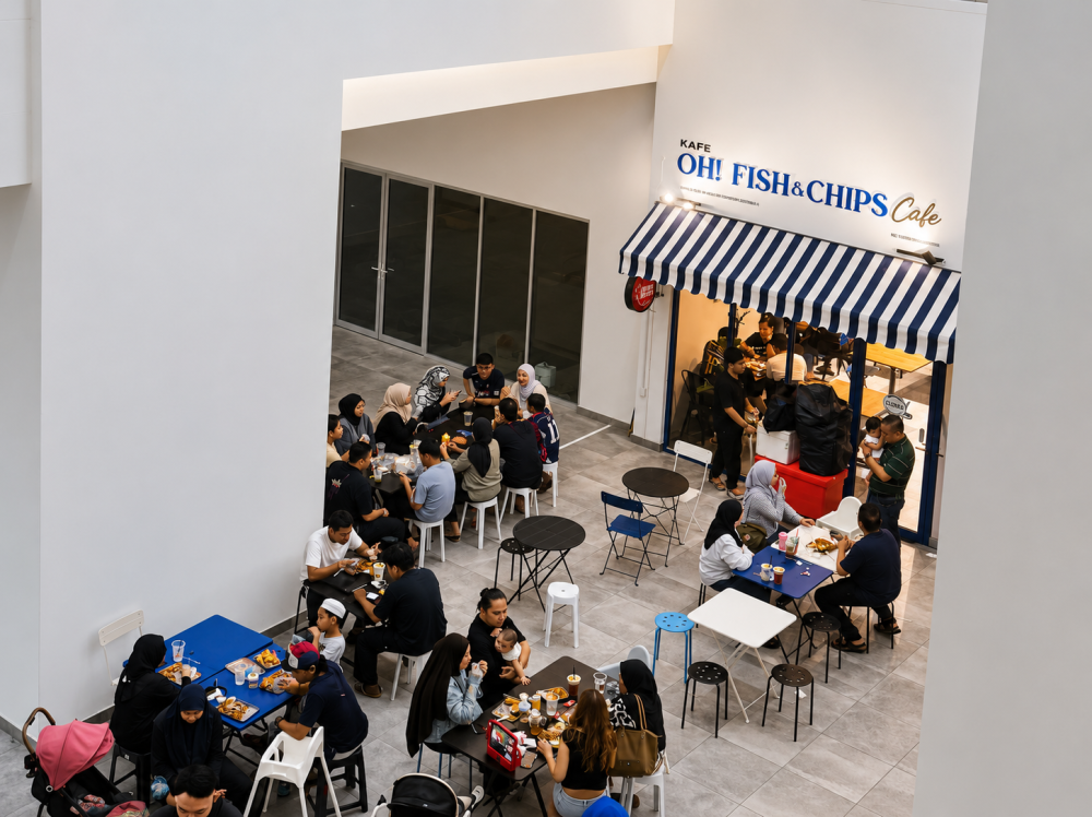 Diners at a local cafe that serves up fish and chips. — Picture by Soo Wern Jun