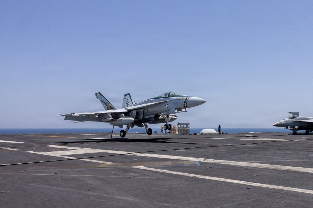This US Navy handout photo released on May 6, 2026 by US Central Command Public Affairs shows an F/A-18E Super Hornet landing aboard Nimitz-class aircraft carrier USS George H.W. Bush (CVN 77) at sea on April 27, 2026. — US Navy handout/AFP pic 