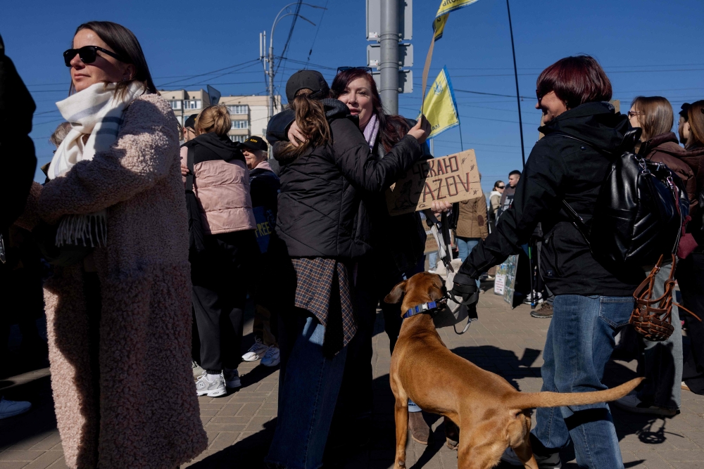 Natalia Kravtsova (centre), 52, mother of an Azov fighter detained since 2022 take part in a rally for Ukrainian prisoners of war calling to speed up their exchange in Kyiv on March 22, 2026, amid the Russian invasion of Ukraine. — AFP pic 