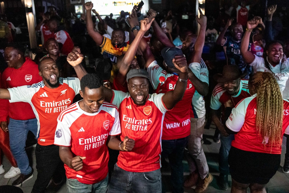 Kenyan fans of Arsenal FC react following their team’s victory during a live broadcast of the club’s Uefa Champions League semi-final match against Atletico Madrid in Nairobi on May 5, 2026. — AFP pic 