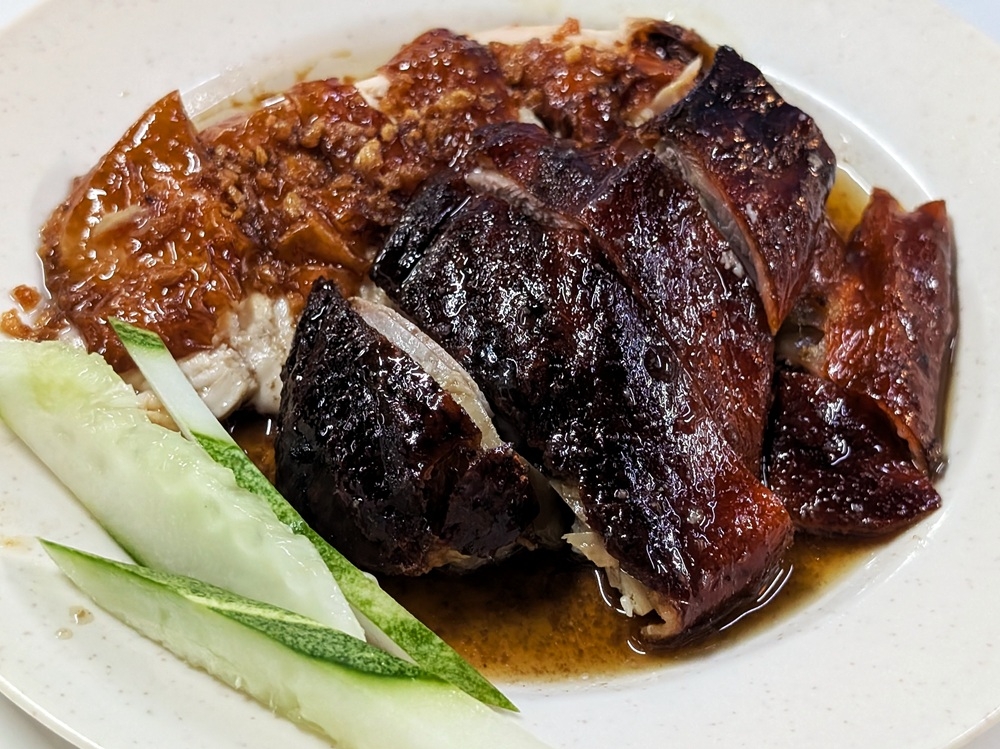 The ideal combination, in my eyes, is the roast duck and roast chicken combo. — Picture by Ethan Lau