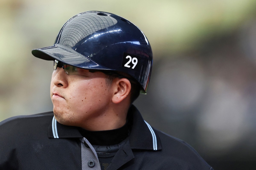 Japan baseball umpires wear 29 in tribute to unconscious colleague