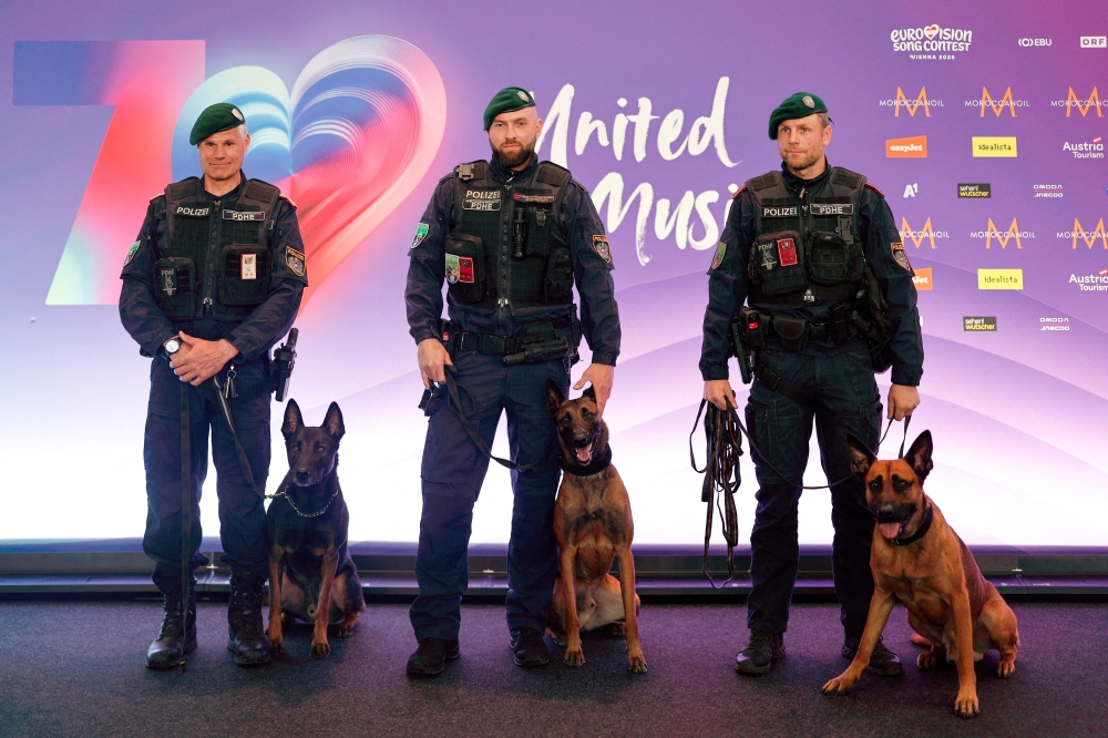 Police officers pose for a photo with K9 units after presenting security measures ahead of the Eurovision Song Contest in Vienna April 29, 2026. — Reuters pic