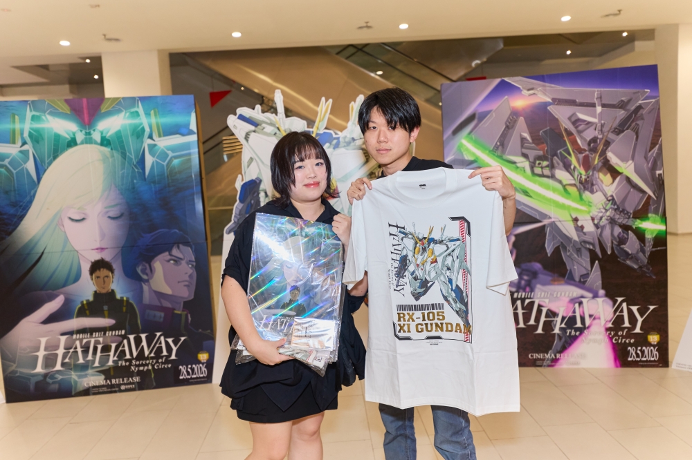 Fans pose with Gundam merchandise before entering the hall for the screening of ‘Mobile Suit Gundam Hathaway: The Sorcery of Nymph Circe’. — Picture courtesy of GSC Cinemas