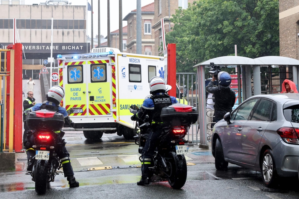 Ambulances transporting French national passengers of the MV Hondius, where an outbreak of hantavirus has been detected, arrive at the Bichat hospital in Paris on May 10, 2026, after a plane repatriating them landed in Le Bourget airport, in the outskirts of Paris. — AFP pic 