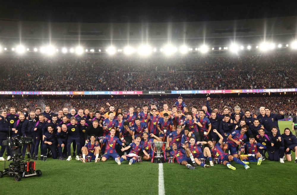 Barcelona’s team celebrates winning the 2025-2026 Spanish League after the Spanish league football match between FC Barcelona and Real Madrid CF at Camp Nou Stadium in Barcelona on May 10, 2026. — AFP pic