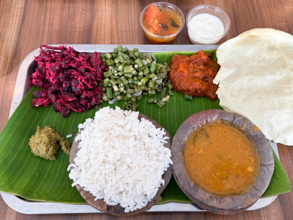 Vegetarian Thali Set is wholesome, featuring three types of cooked vegetables, curd, rasam and pappadam — Picture by Lee Khang Yi