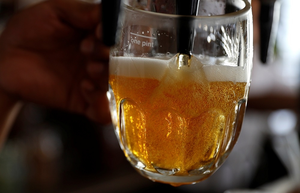 A pint of beer is poured into a glass in a bar in London June 27, 2018. — Reuters pic