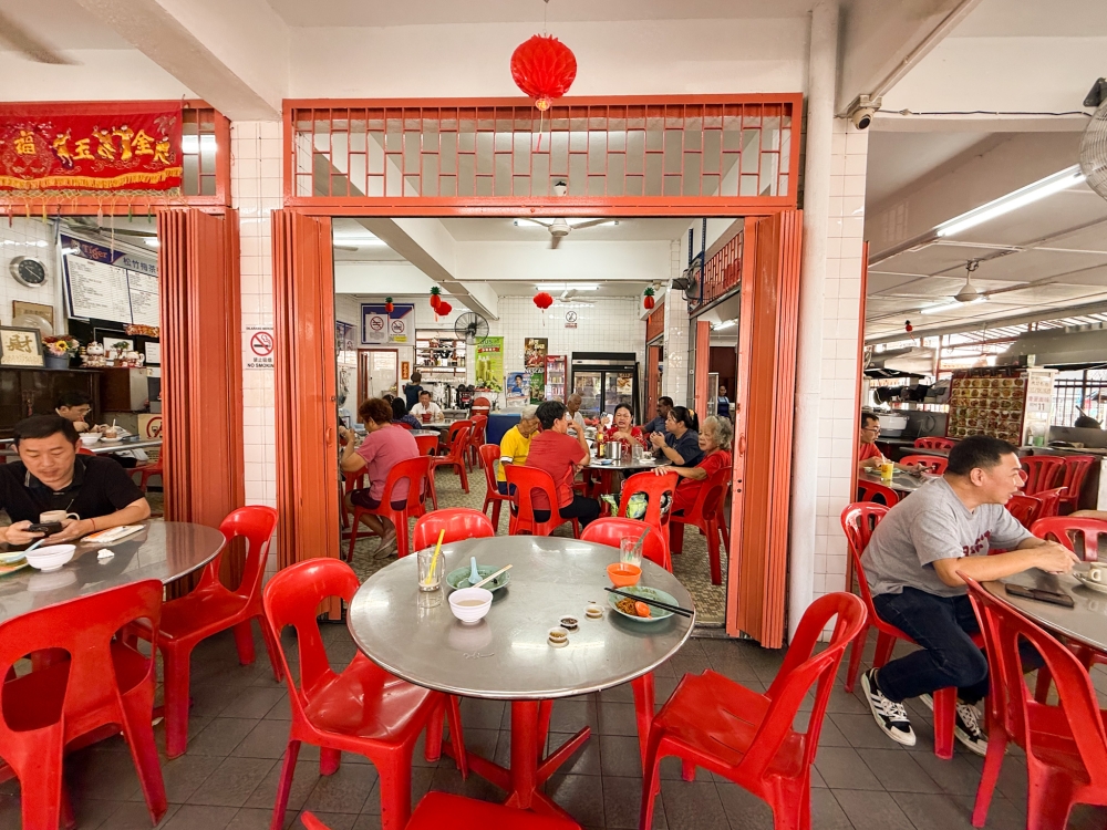 This coffeeshop is spruced up with newer tables and packed with regulars -- Picture by Lee Khang Yi