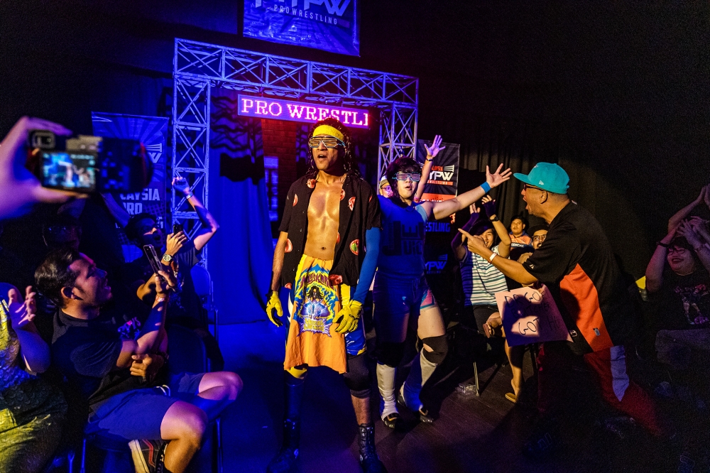Miles Karu and The Wonderboy make their entrance at the 2024 Champions Quest event before becoming the first Malaysians to win the SPW Southeast Asia Tag Team Championships. — Picture by Firdaus Latiff