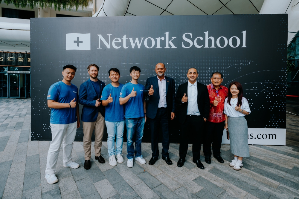 Digital Minister Gobind Singh Deo (fourth from right) and his deputy Datuk Wilson Ugak at Base Builder’s Loft, Network School in Forest City, Johor, with Balaji Srinivasan (third from right) and Base representatives posted on April 17, 2026. — Picture from X/Base APAC
