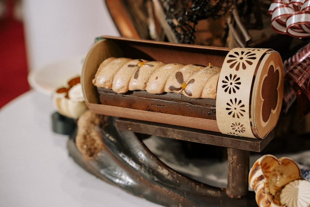 The ‘fleurelle’ is a French travel cake  created by the Malaysian team, comprising chocolate marzipan, orange confit, caramalised nuts and light brownie cake glazed in Guanaja ganache.  — Picture courtesy of APCA