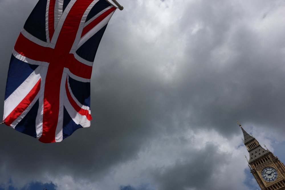 A Union Jack flag flutters near the Elizabeth Tower, commonly known as Big Ben, in London on May 14, 2026, following the resignation of British Health Secretary Wes Streeting. — Reuters pic