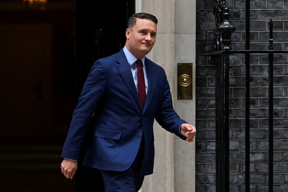 British Health Secretary Wes Streeting walks on Downing Street, on the day of the State Opening of Parliament, in London May 13, 2026. — Reuters pic