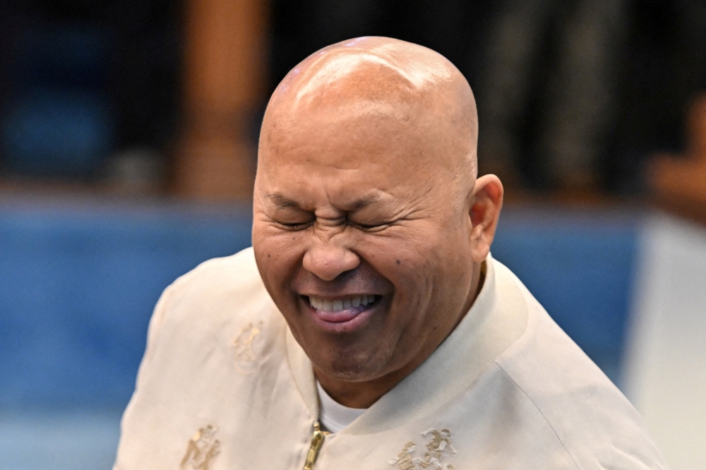 Philippine Senator Ronald dela Rosa, the chief enforcer of former President Rodrigo Duterte's deadly ‘war on drugs,’ reacts before the start of a plenary session at the Senate in Pasay City, Metro Manila May 12, 2026. — Reuters pic