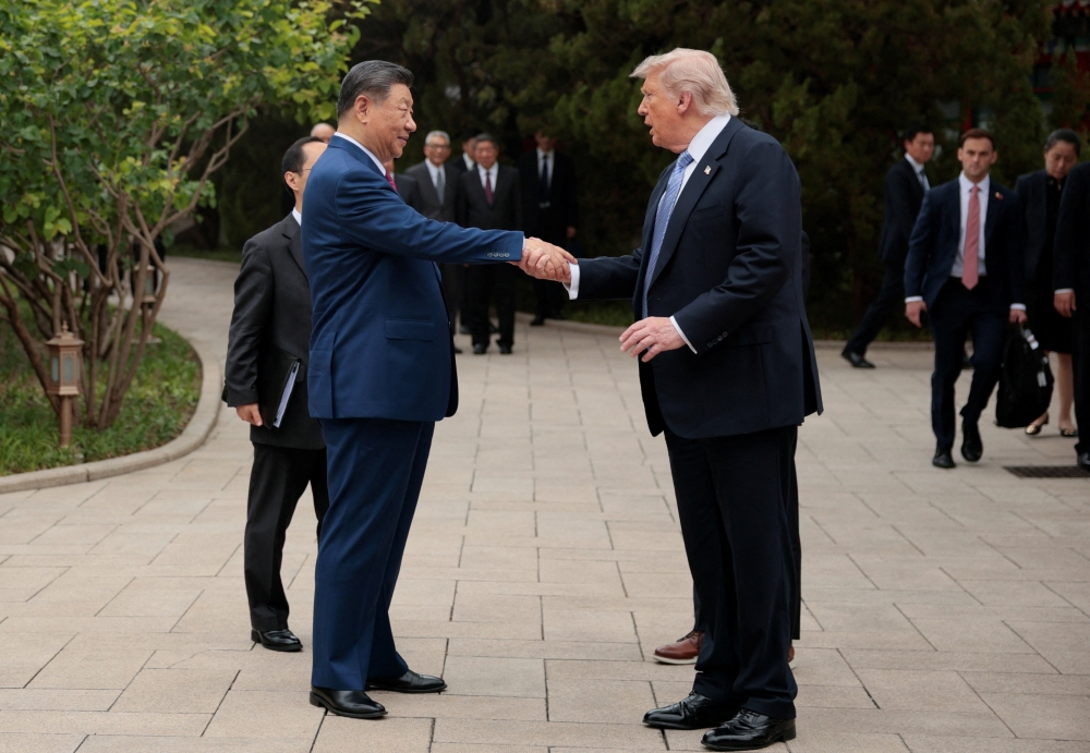 US President Donald Trump shakes hands with Chinese President Xi Jinping as he departs from the Zhongnanhai Garden in Beijing on May 15, 2026. — Reuters pic