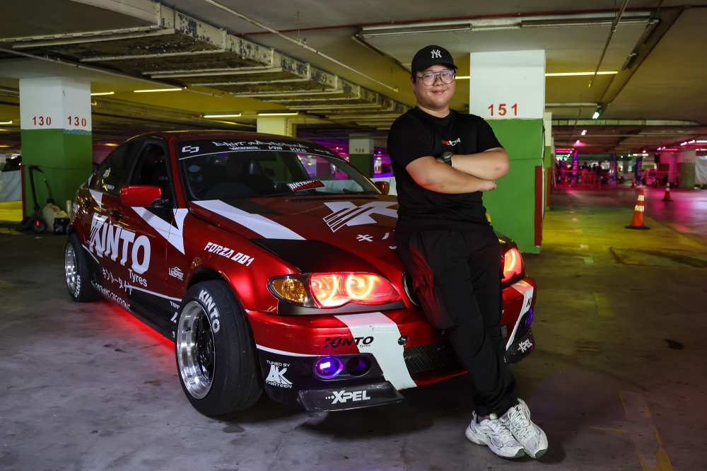 Ho poses for a picture with his modified BMW E46 at Drift Underground 2026 held at the Mines International Exhibition and Convention Centre in Seri Kembangan. — Picture by Yusof Isa