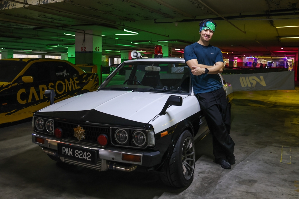 Yong poses for a picture with his modified Corolla E70 at Drift Underground 2026 held at the Mines International Exhibition and Convention Centre in Seri Kembangan. — Picture by Yusof Isa