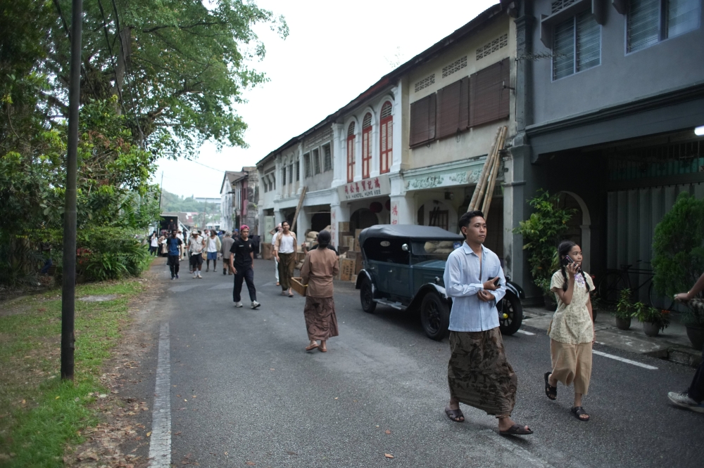Behind-the-scenes exterior shot from the production of ‘Hemelrijk’ with cast dressed in retro clothing. — Picture by Cho We Jun