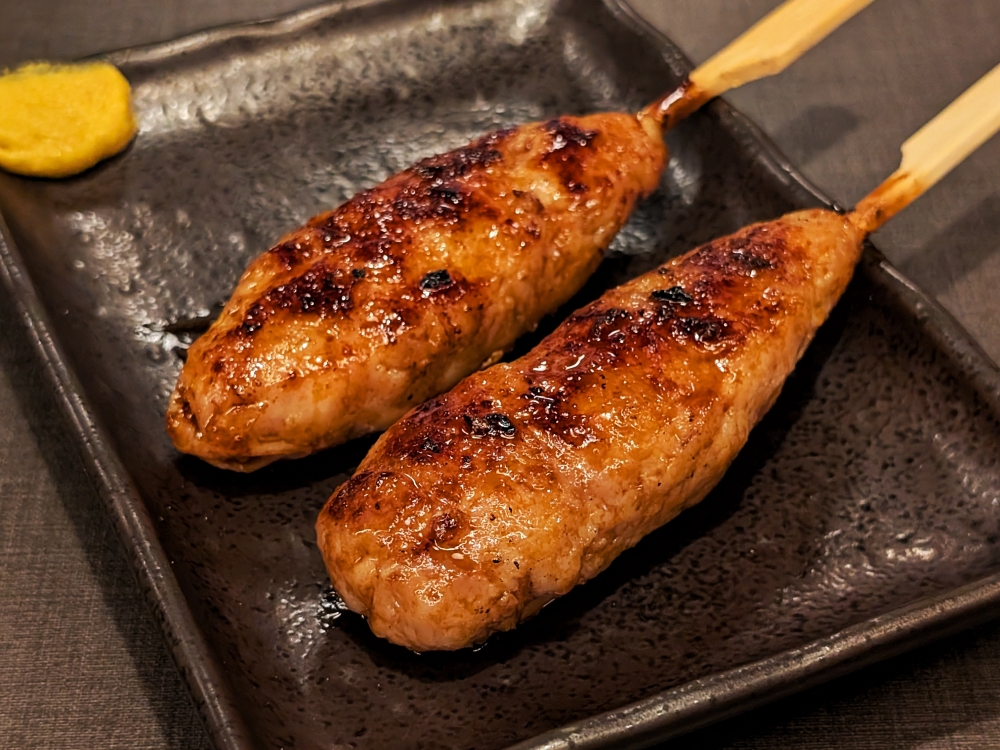 The ‘tsukune’ is grilled with ‘tare’ and served with a bit of mustard on the side. — Picture by Ethan Lau