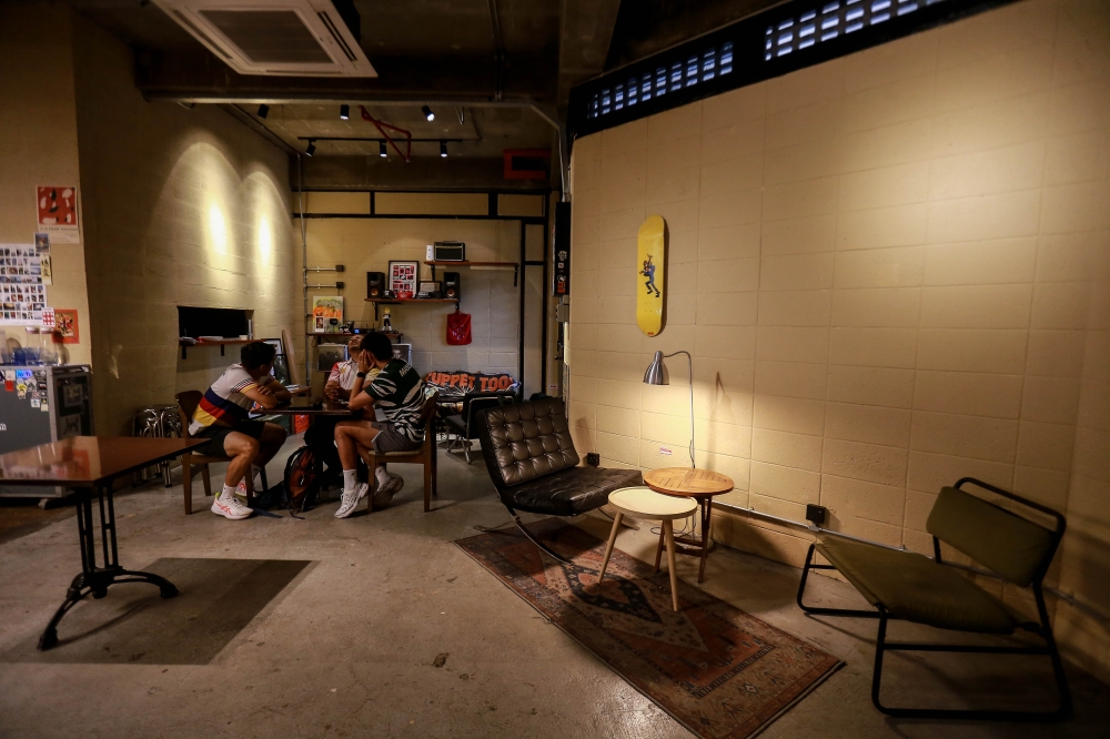 Customers sit inside Jilid Enam, one of several newer cafes and creative spaces helping revive Pusat Daerah Seksyen 6 in Shah Alam. — Picture by Sayuti Zainudin