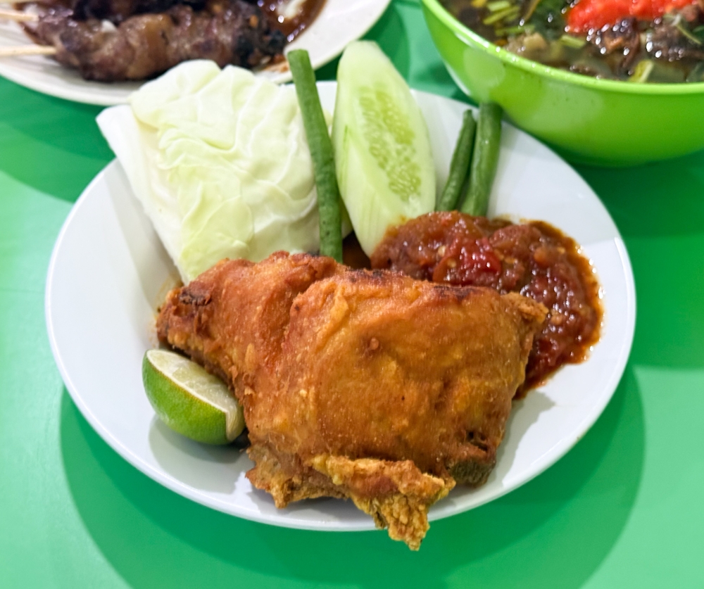 Pecel Ayam boasts a golden skin and juicy meat inside. — Picture by Lee Khang Yi