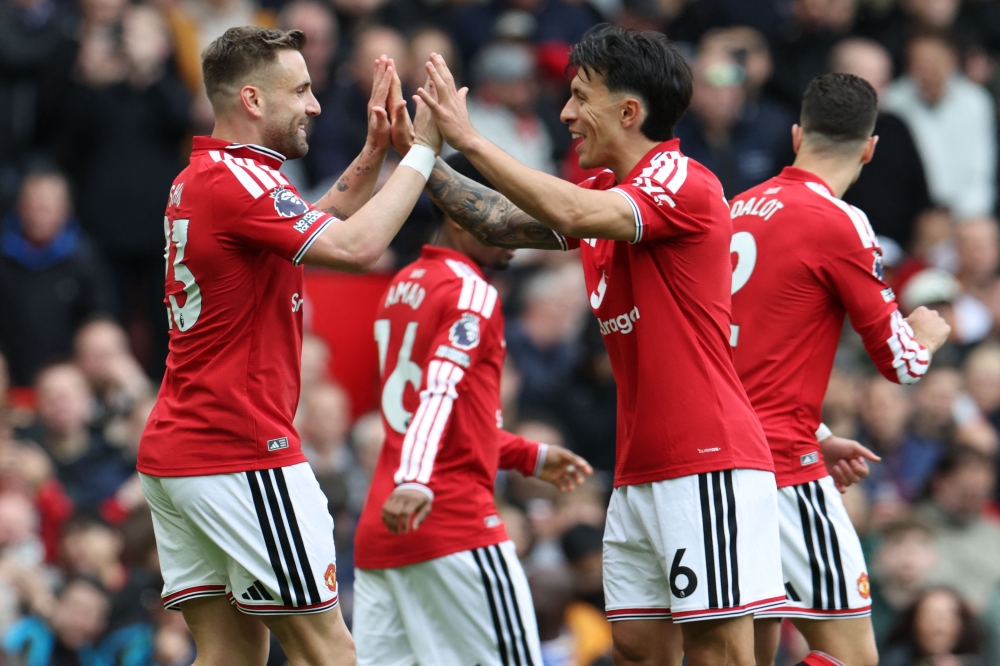 Manchester United’s English defender Luke Shaw (left) celebrates with Manchester United’s Argentinian defender Lisandro Martinez (right) after scoring the opening goal during the English Premier League football match between Manchester United and Nottingham Forest at Old Trafford in Manchester, north west England, on May 17, 2026. — AFP pic