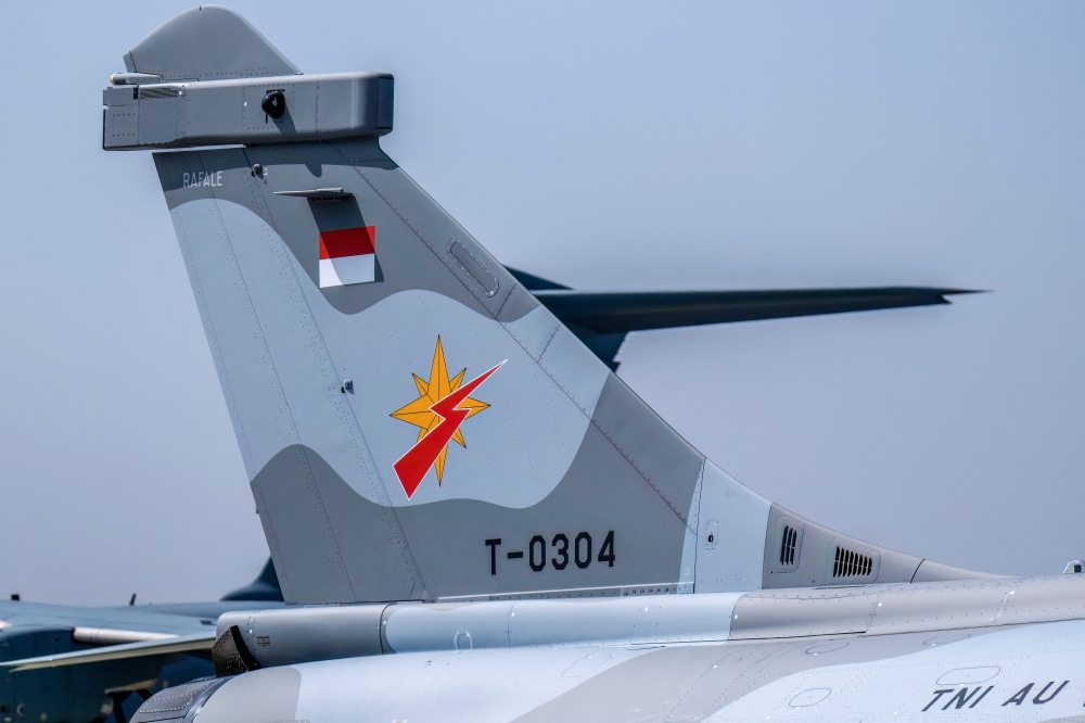 The logo of the Indonesian Air Force’s (TNI AU) Air Squadron 3 (The Dragon) is seen on the tail of a Rafale jet fighter during a ceremony to hand over six new Rafale jet fighters, six Dassault Falcon 8X aircrafts and two Airbus A400M Atlas transport planes to the Indonesian Air Force at Halim Perdanakusuma Air Force Base in Jakarta on May 18, 2026. — AFP pic