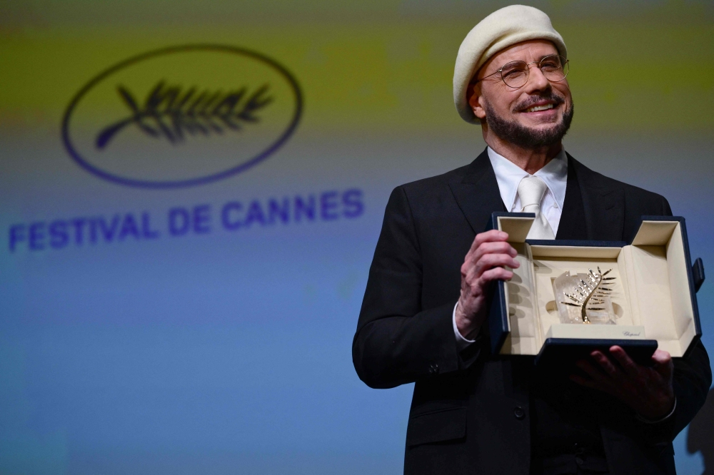John Travolta says directorial debut pays tribute to cinema greats despite mixed reviews