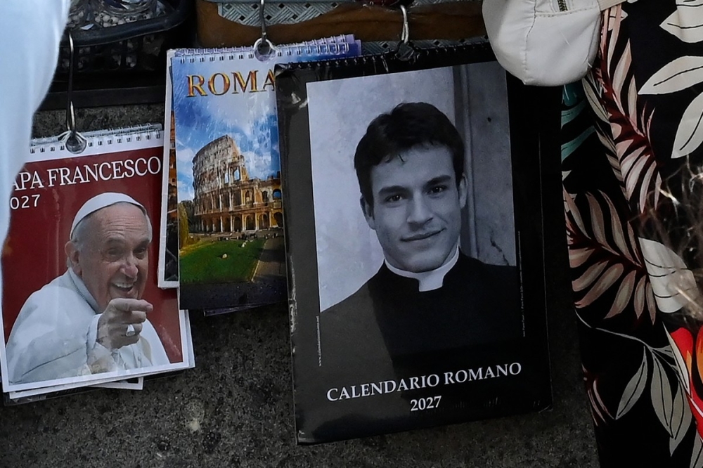 Rome’s famous ‘sexy priest’ calendar model admits he was never a priest