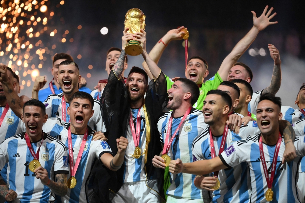 This file picture shows Argentina forward Lionel Messi lifting the Fifa World Cup trophy after Argentina defeated France in the Qatar 2022 final at Lusail Stadium in Lusail, north of Doha, December 18, 2022. — AFP pic This file picture shows Argentina forward Lionel Messi lifting the Fifa World Cup trophy after Argentina defeated France in the Qatar 2022 final at Lusail Stadium in Lusail, north of Doha, December 18, 2022. — AFP pic