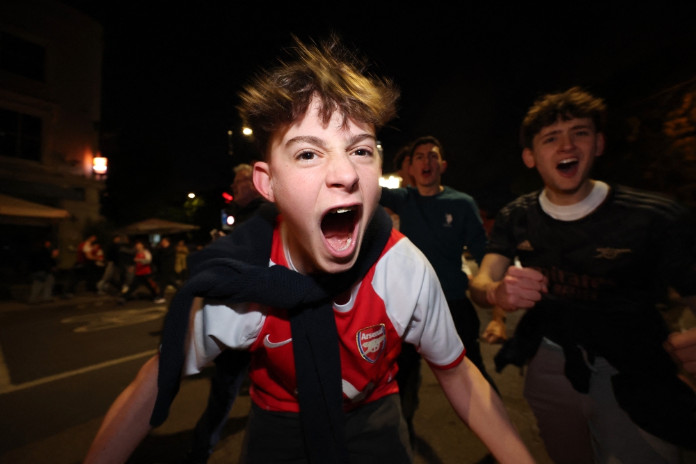 Arsenal fans celebrate outside the Emirates Stadium in London after the club won the Premier League, May 19, 2026. — Reuters pic
