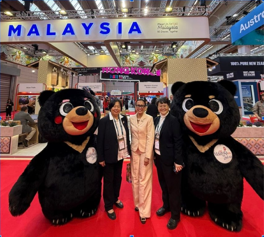 Visit Malaysia Year 2026 sun bear mascots Wira and Manja make an appearance at the Malaysia Pavilion.