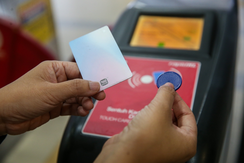 Now, you can only use a Touch ‘n Go card or a token to tap in and out for Rapid KL’s train rides, as seen here. — Picture by Choo Choy May