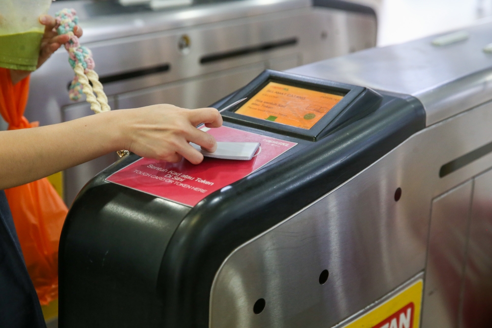 While there are future plans to enable alternative tap-in and tap-out methods such as credit cards and mobile wallets, using a Touch 'n Go card is the more convenient option now. — Picture by Choo Choy May 