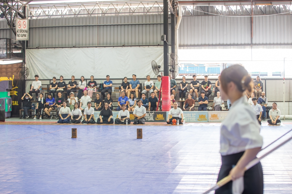 Spectators and fellow practitioners watch attentively as an archer prepares to shoot during a kyudo martial arts demonstration in Petaling Jaya. — Picture by Raymond Manuel