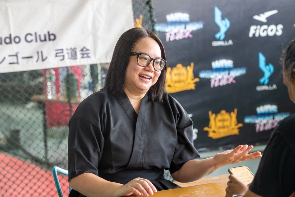 Shereen Dulau, club president, speaks during an interview at a traditional Japanese archery demonstration. — Picture by Raymond Manuel