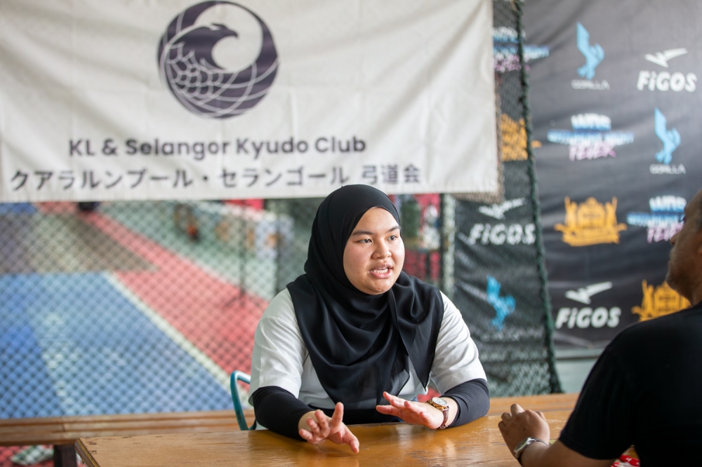 Syafiqah Dayana Borhan shares her journey during a traditional Japanese archery showcase. — Picture by Raymond Manuel