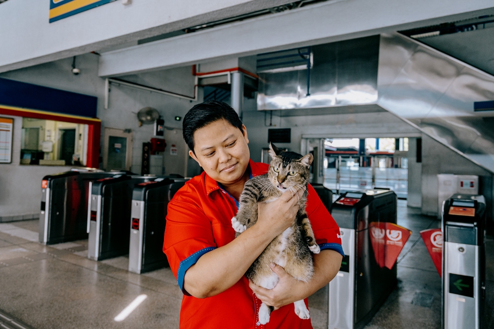 Kenit is seen here being held by LRT Ampang station manager Hamisah Aziz. — Picture by Firdaus Latif