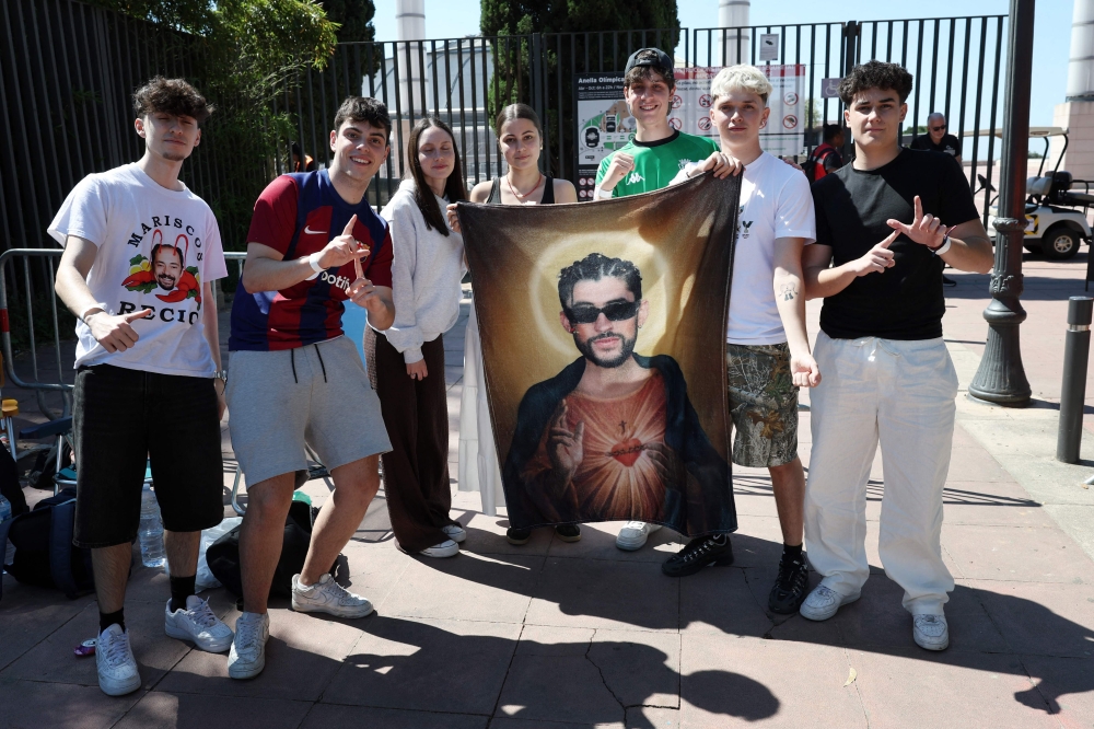 Bad Bunny fans pose outside the Estadi Olimpic Lluis Companys in Barcelona, as they queue for the Puerto Rican superstar’s World Tour’s first European show on May 22, 2026. — AFP pic