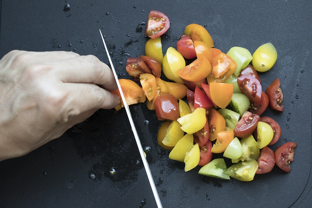 Roughly slice the heirloom cherry tomatoes. — Picture by CK Lim