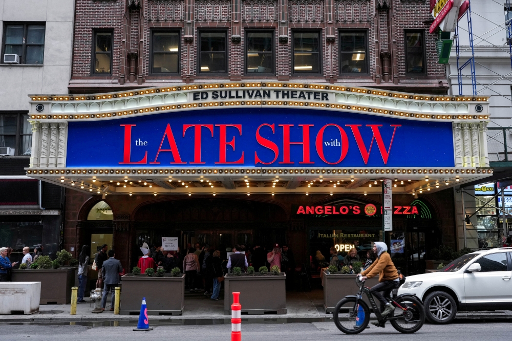 People gather outside of the Ed Sullivan Theatre before the taping of the final episode of the ‘The Late Show’ with Stephen Colbert, in New York City May 21, 2026. — Reuters pic