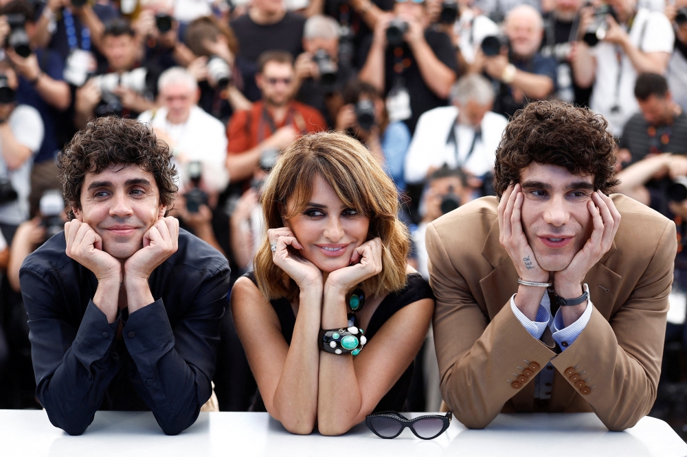 Directors Javier Ambrossi and Javier Calvo, and cast member Penelope Cruz pose during a photocall for the film ‘La bola negra’ (The Black Ball) in competition at the 79th Cannes Film Festival in Cannes May 22, 2026. — Reuters pic